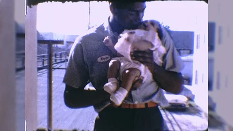 1960s African American Black Father Holds Child Together Vintage Film Home Movie Stock Footage