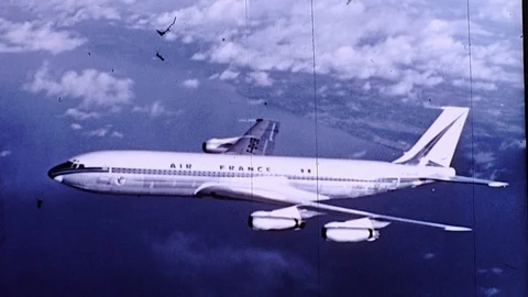 1960s Airplane Jet Plane Air France Flying in Sky Clouds Vintage Old Film Movie Stock Footage