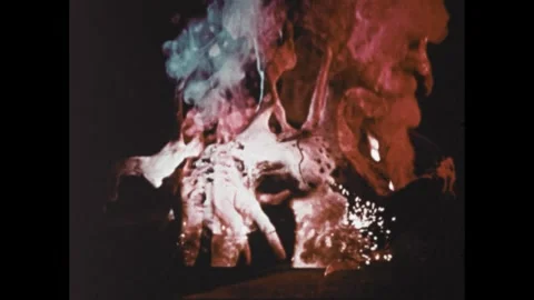 1960s: Animation, man in space suit cutting plant. Shots of plants on fire. Men Stock Footage 307513963