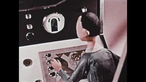 1960s: Animation, men sitting at controls in spacecraft. Close up of gauge. Man Stock Footage 307513777