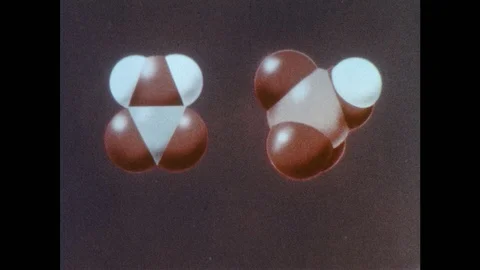 1960s: Animation.  Molecule splits into pieces.  Text reads "NITRONIUM ION" and Stock Footage 97014157