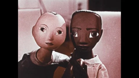 1960s: Animation, planet surface on screen. Close up of men with microphone. Stock Footage 307513871
