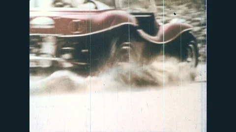 1960s: Antique dune buggy, marching band trumpet player. People playing in Stock Footage