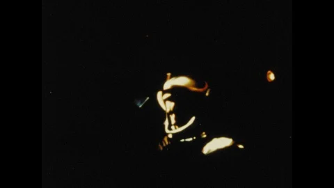 1960s: Astronaut operates controls in cockpit of space craft. Gemini space craft Stock Footage 101665454