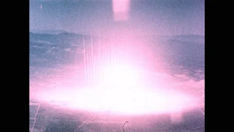 1960s: Atomic bomb explodes in desert, mushroom cloud rises into sky. Stock Footage 159489597