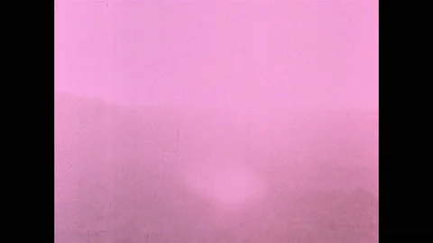 1960s: Atomic bomb explodes in desert, mushroom cloud rises into sky. 스톡 동영상 159489650