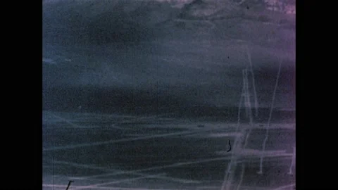 1960s: Atomic bomb explodes in desert, mushroom cloud rises into sky. Stock Footage 159489692