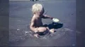 1960s Baby Blond Surfer Little Boy Play in Wave at Beach Vintage Film Home Movie HD Footage