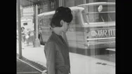 1960S Baltimore: City Street.  Woman Window Shops.  Teenage Girl Follows Woman.  Stock Footage