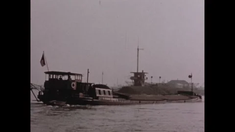 1960s: Barge on water.  Map.  Shipyard.  Docks. Stock Footage 257363558