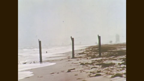 1960s: Beach and ocean front. Sky and clouds. Stock Footage