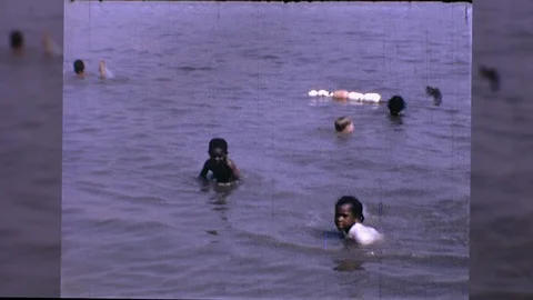 1960s Black African American Black Kids Play at Beach Vintage Film Home Movie Stock Footage