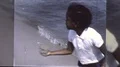 1960s Black African American Black Kids Play at Beach Vintage Film Home Movie HD Footage