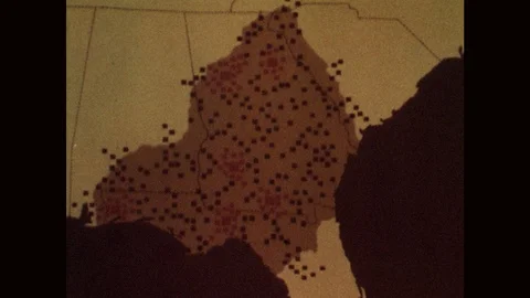 1960s: Black and red dots on map of United States. Red dots increase, black dots Stock Footage 122015545