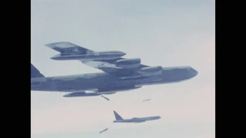 1960s: Bombs fall from airplanes flying in sky. 스톡 동영상 141345173