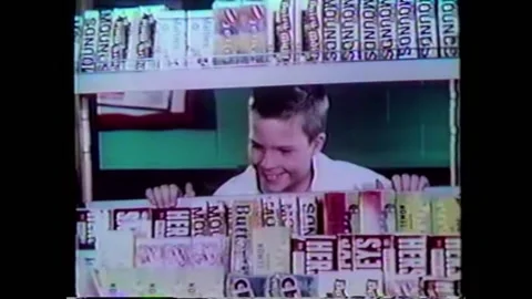1960s - A boy dreams of operating his own candy store in this advertisement for Stock Footage 161014192