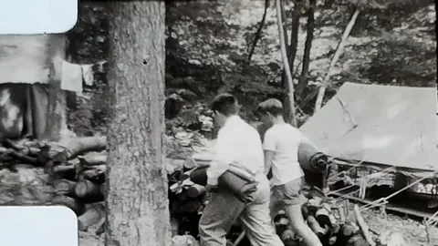 1960s boy scouts walking through camp. Vintage 8mm Home Video. Stock Footage 264527876