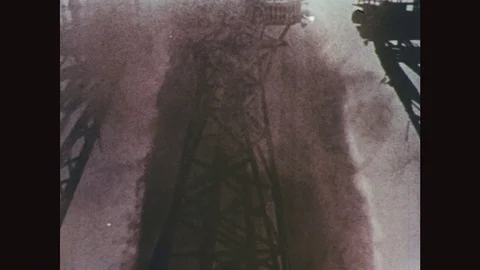 1960s: Breaking launch base structure under column of smoke and flame. Rocket Stock Footage 77217755