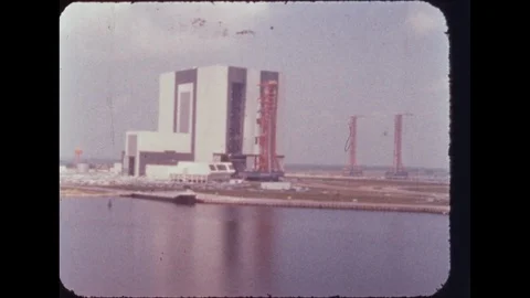 1960s: Building.  Rocket on launch pad.  Water. Vídeos de archivo 113944533