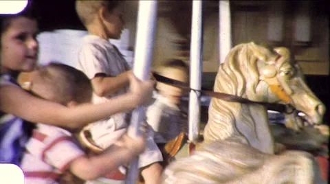 1960s Children Ride Carousel Wooden Horse Amusement Park Vintage Film Home Movie Stock Footage