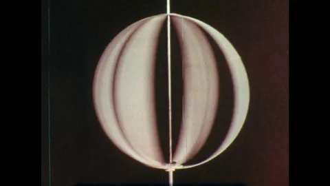 1960s: Circular object on machine spins around. Hand moves lever and the object Stock Footage 82730818