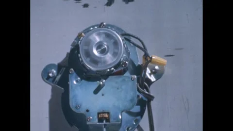 1960s: Close up of back of clock, parts moving. Video stock 249559148