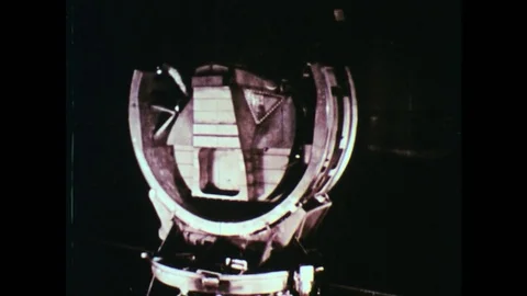 1960s: Close up of engineering on space rocket as it turns slowly before launch. Stock Footage 75092214