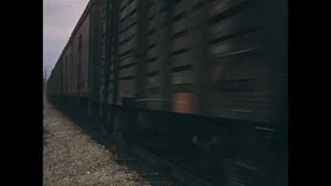 1960s: Close-up of freight train running down tracks. Stock Footage 277675259