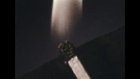 1960s: Close up of match striking / View of gear turning. Stock Footage 74779251