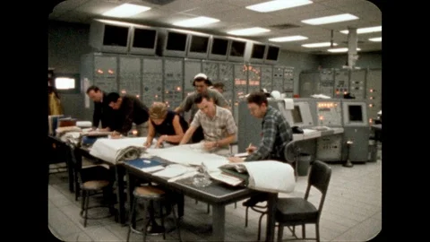 1960s: Computers.  People work at table. Stock Footage 113943750