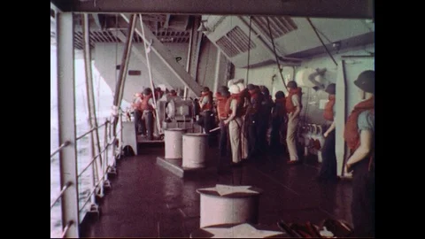 1960s : Crew Engaged with Ship to Ship Refuelling Whilst at Sea Stock Footage 74675027
