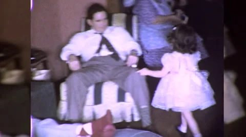 1960s Cute Little Girl Sits in Daddy's L... | Stock Video