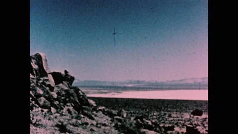1960s: Desert, atomic bomb explodes, cloud puffs into sky. 스톡 동영상 159489442