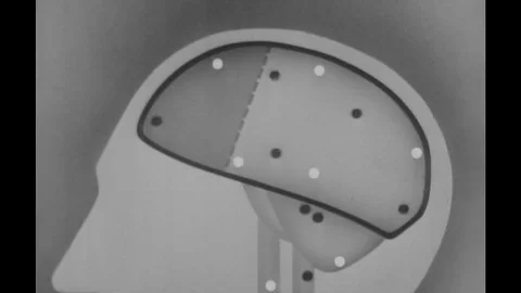 1960s: diagram of particles moving inside brain Stock Footage 74819622