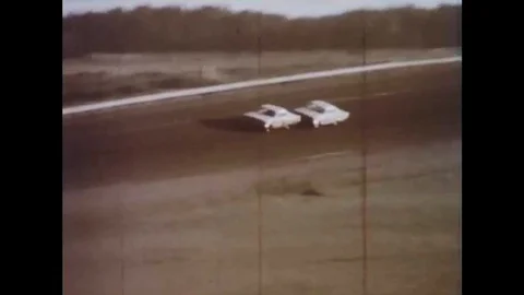 1960s - Driver Tiny Lund holds the lead in the 5th Annual Daytona 500, in 1963. Video stock 132200212