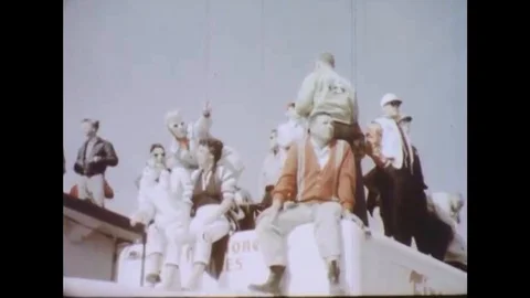 1960s - Drivers stop for pit stops but racer Tiny Lund keeps driving, during the Video stock 132199803