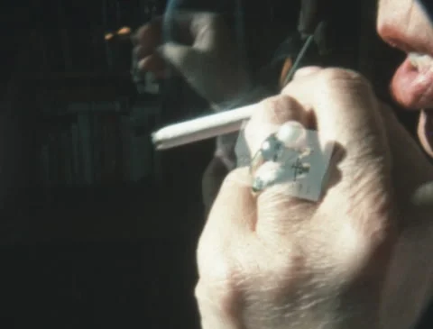 1960s ELDERLY LADY LIGHTS A CIGARETTE WITH JAPANESE MATCHES (1968) Stock Footage 283936651