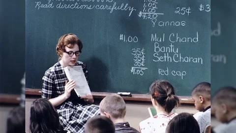 1960s Elementary School Student Teacher Gives Test Assignment Vintage Film Movie Stock Footage