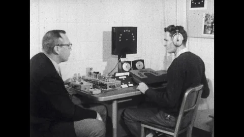 1960s: Engineering psychologist Dr. Paul M. Fitts in bowties and glasses speaks Stock Footage 129971659
