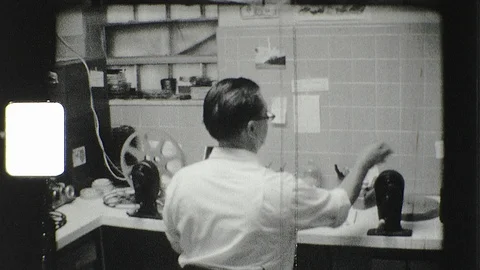 1960s Filmmaker Man Edits 16mm Editor Reels Vintage Old Film Home Movie Stock Footage 114204688