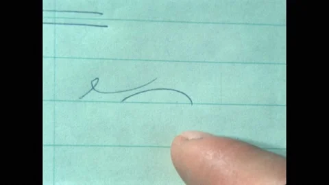 1960s: A finger points at a scribble on a lined piece of paper. A blonde woman Stock Footage 171187701