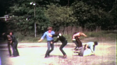 1960s GANG FIGHT Fist Teens Boys Fighting Male Violence Vintage Film Home Movie Stock Footage