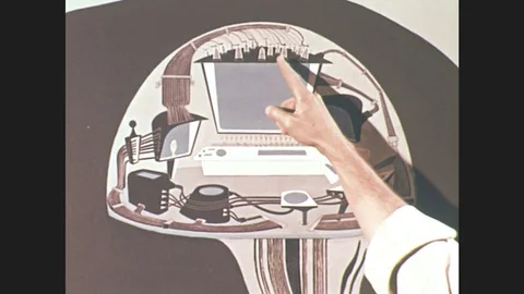 1960s: hand points to drawing of wires on a television screen. men look at map Stock Footage
