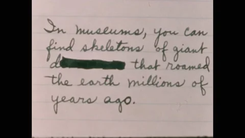 1960s: Handwritten paragraph on paper with one word marked out. Word marked out Vidéo 238928107