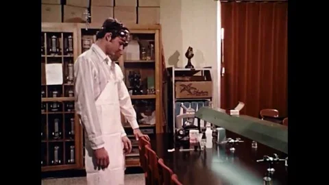 1960s - High school students take the proper safety precautions in their Science Video stock 132200602