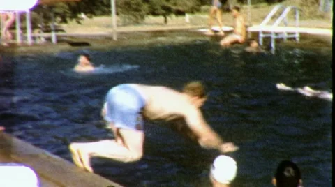 1960s KIDS DIVE PLAY SWIM into Swimming POOL Jump Splash Vintage Film Home Movie Stock Footage