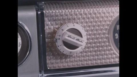 1960s: Kitchen.  Timer on stove.  Shooting slate.  Computer lab.  Woman checks Stock Footage 278920963