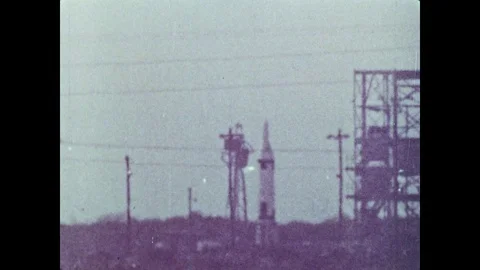 1960s: Launch pad.  Rocket launches and explodes.  Pieces fall to ground. Stock Footage 102737119