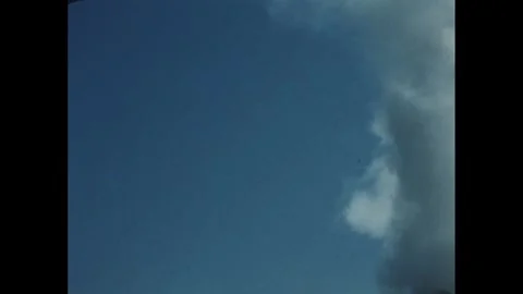 1960s: Low angle, puff of smoke. Stock Footage 246751510