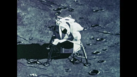 1960s: Lunar module detaches from base, lifts off moon, docks with command Stock Footage 100302186